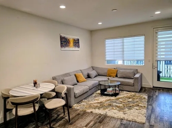 Garage conversion in Los Angeles transformed into modern living space by T&N Remodeling Inc